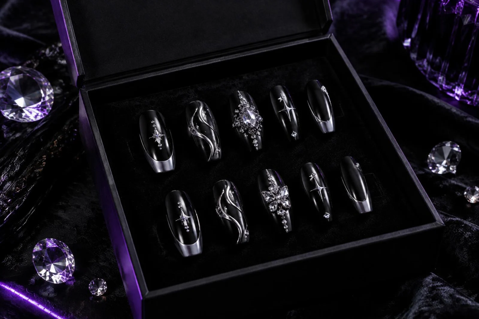 Concept black and silver press-on set in an open black box