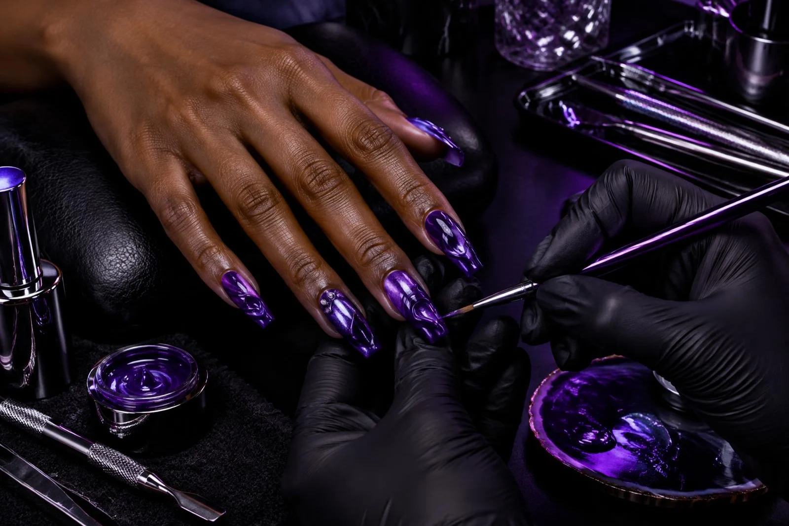 Illustrative refresh of a purple sculpted nail set