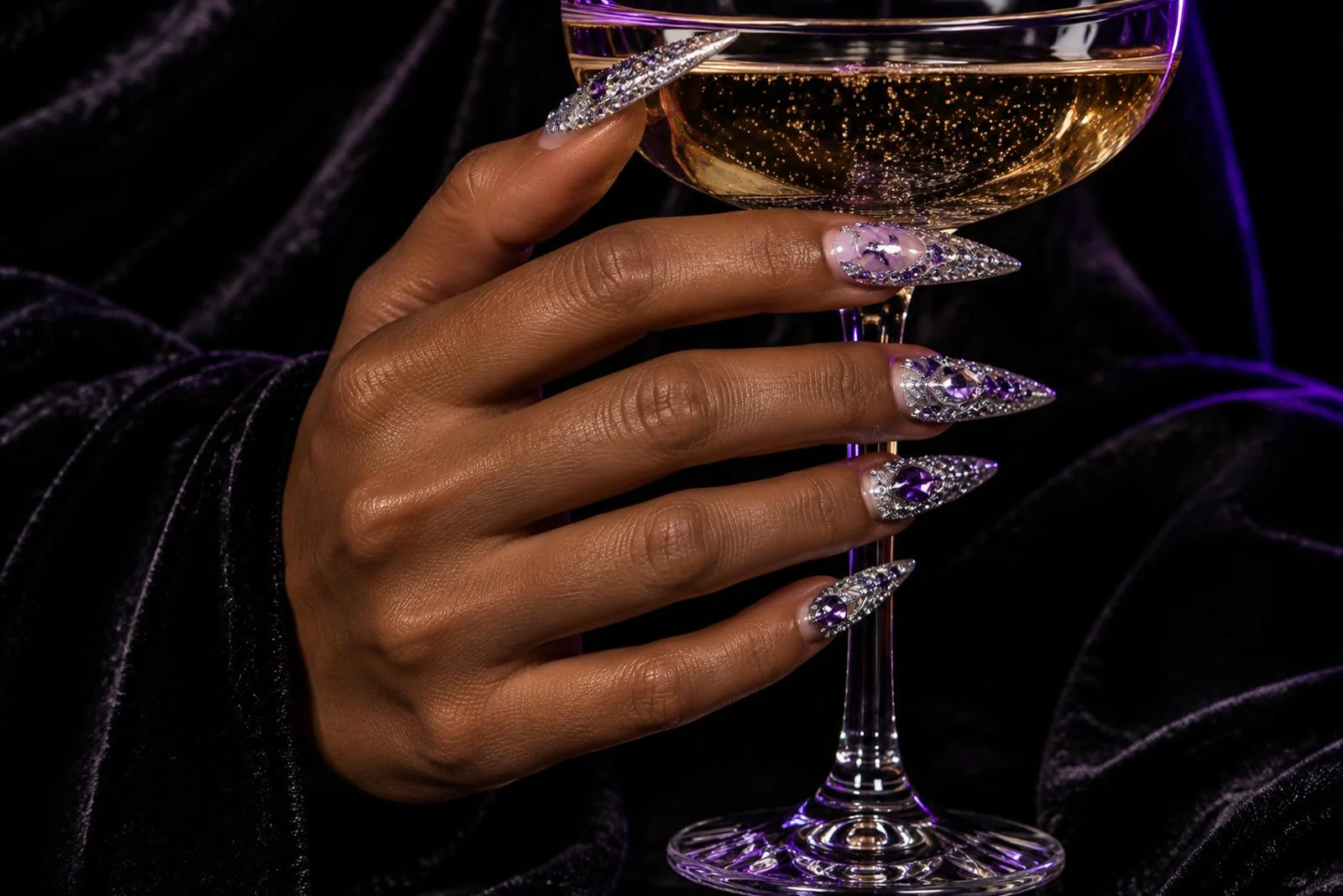 Inspiration crystal occasion nails holding a champagne glass